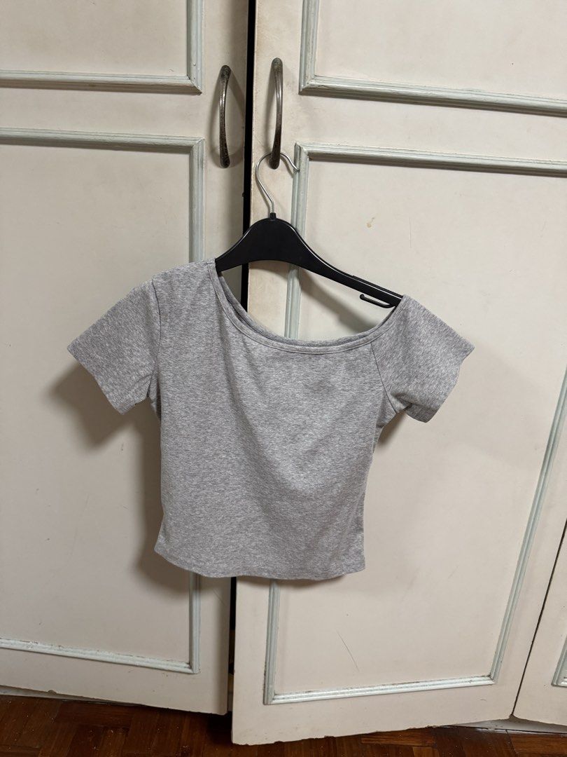 SHEIN Gray Cropped Off shoulder Top - Size M (Category: Others Tops) located in Manila. Submitted by deluxelabphilippines (Listing ID 1438089191, Image 1). Description: - Gray cropped off-shoulder top - Size: M - Unique neckline - Short sleeves - Fabric: 96% cotton, 4% elastane - Length: Approximately 18 inches - Width: Approximately 16 inches - Care: Hand wash only.