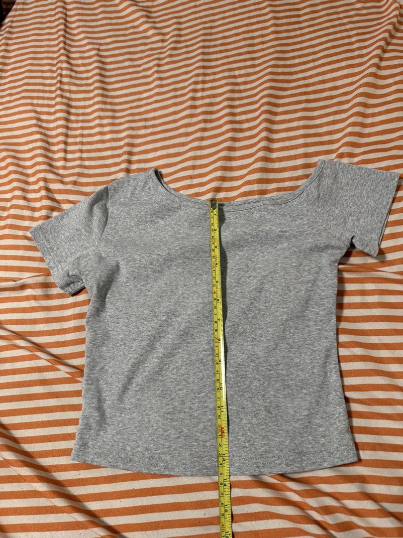 SHEIN Gray Cropped Off shoulder Top - Size M (Category: Others Tops) located in Manila. Submitted by deluxelabphilippines (Listing ID 1438089191, Image 3). Description: - Gray cropped off-shoulder top - Size: M - Unique neckline - Short sleeves - Fabric: 96% cotton, 4% elastane - Length: Approximately 18 inches - Width: Approximately 16 inches - Care: Hand wash only.