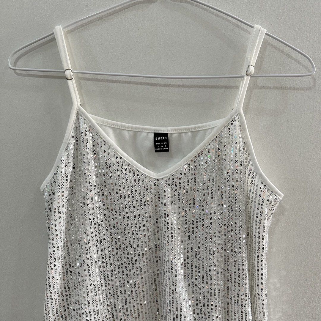 Shimmery Top (Shein) (Category: Blouses) located in Taguig. Submitted by k_bloom (Listing ID 1438109346, Image 3). Description: Item: Top Color: White and Silver Brand: Shein Size: Small Condition: Like New Reason for Selling: Decluttering. Used only once for Party. ——————————————————————— Mode of Payment: Online payment only via Gcash, BPI or BDO Delivery: Shipping fee c/o buyer •Within NCR- via lalamove/grab/J&T/GogoXpress •Outside NCR- via LBC
