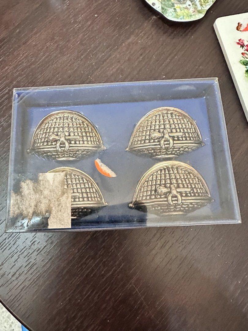 Silver plated napkin rings (Category: Other Kitchenware & Tableware) located in Quezon City. Submitted by mystictiger.019d9c (Listing ID 1438108016, Image 1). Description: - Set of four silver plated napkin rings - Features a charming beehive design. - Made of metal. - Comes with a box. - Detailed pattern and clasp detail. - Perfect for vintage home decor..