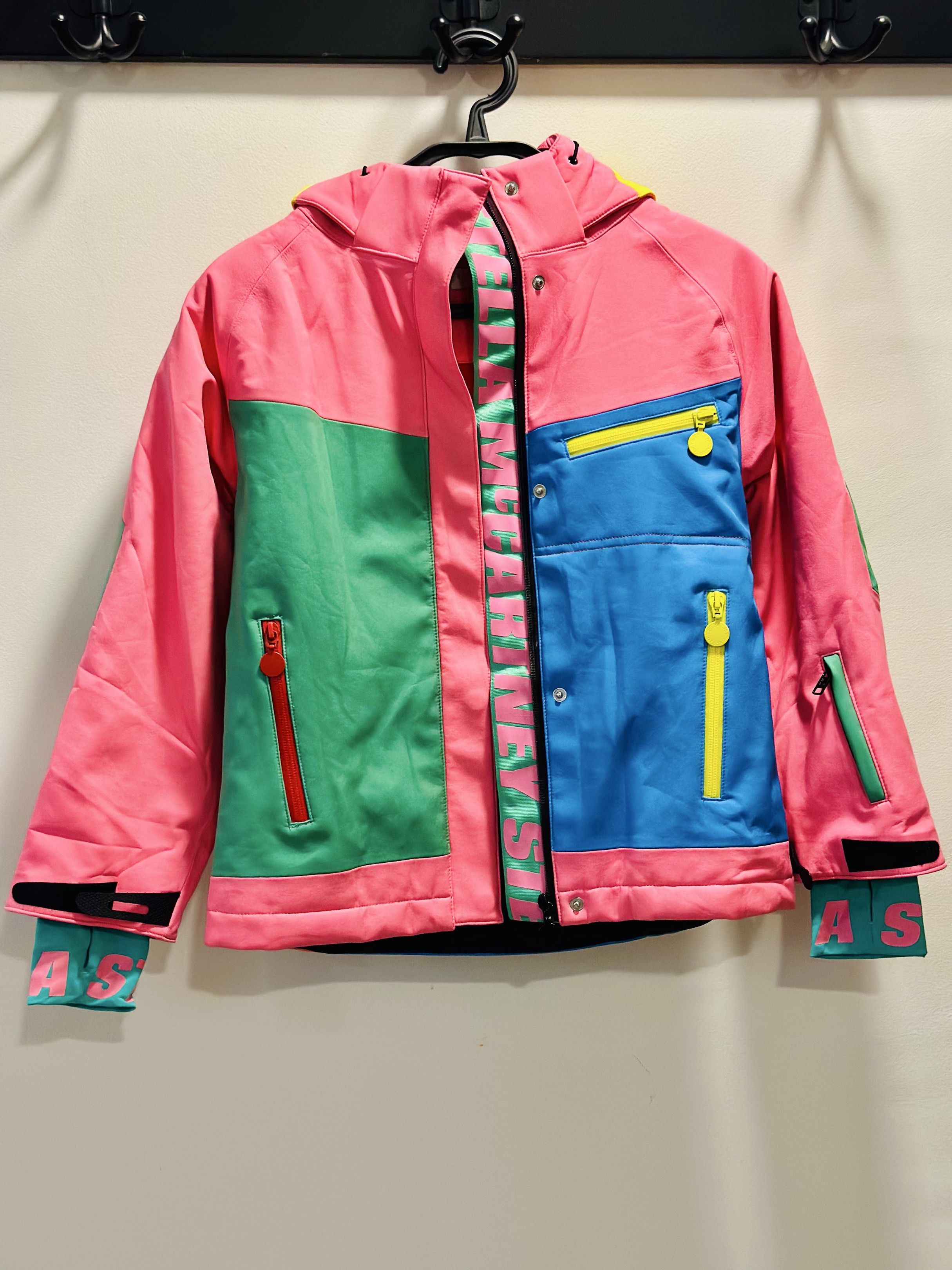 Stella McCartney Kids Ski Jacket 8 Years (Category: Babies & Kids Fashion) located in Baliuag. Submitted by _twinkledust (Listing ID 1437987266, Image 1). Description: - Stella McCartney Kids ski jacket - Vibrant color block design - Size: 8 years - Features a hood - Multiple pockets with zippers - Brand name printed on inner lining and cuffs - Retails for 17k+.