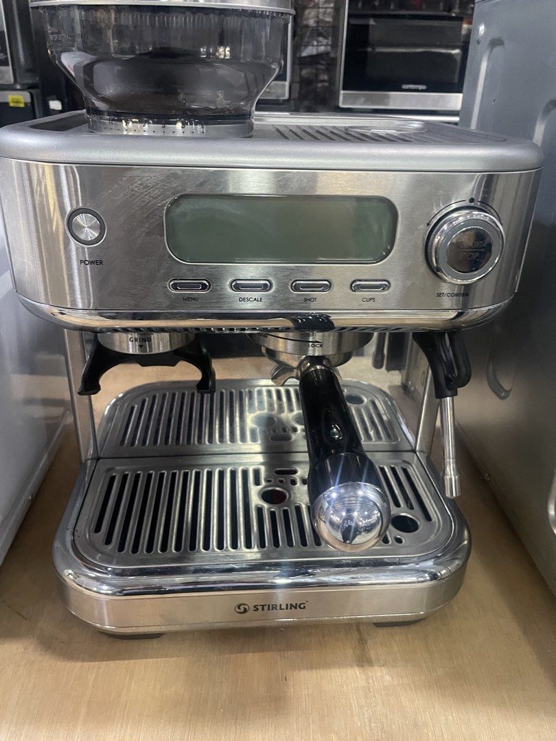 Stirling Espresso Machine with Grinder (Category: Coffee Machines & Makers) located in Manila. Submitted by PickShop (Listing ID 1437982555, Image 1). Description: - Stirling espresso machine - Built-in grinder - Digital display - Buttons: Power, Menu, Descale, Shot, Cups - Stainless steel finish - Includes portafilter.