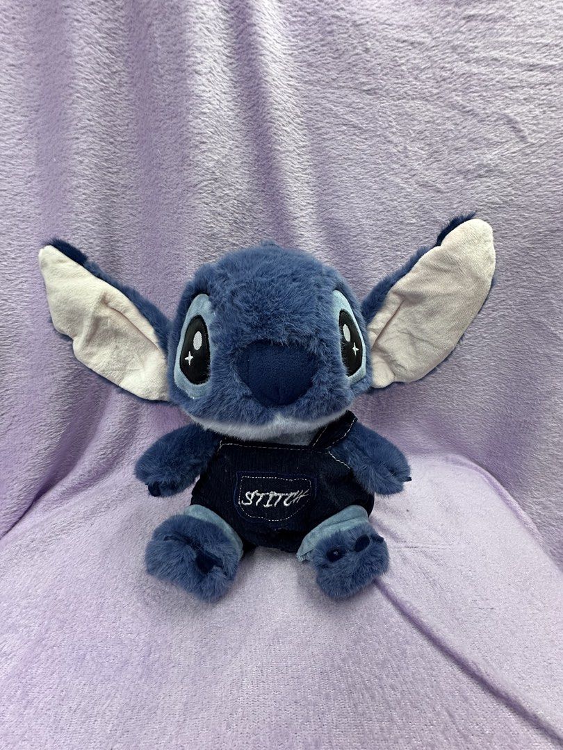 Stitch Plush Toy with Outfit (Category: Plushies & Soft Toys) located in Manila. Submitted by rinasclutter (Listing ID 1438028305, Image 3). Description: - Adorable Stitch plush toy - Comes with a removable outfit - Features Stitch's blue fur, large eyes, and floppy ears - Outfit includes a black hoodie and a shirt with the number "626" - Perfect for Disney fans and collectors.