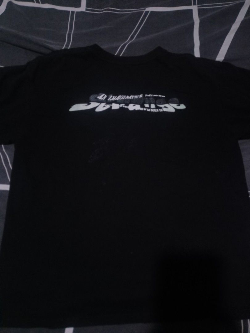 Strange The Lost Artist Graphic Tee (Category: Tshirts & Polo Shirts ) located in Manila. Submitted by around_marikina (Listing ID 1438099165, Image 2). Description: - Black graphic tee - Front print: Person with "Strange" and "The lost artist" - Back print: "Strange" - Short sleeves - Crew neck.