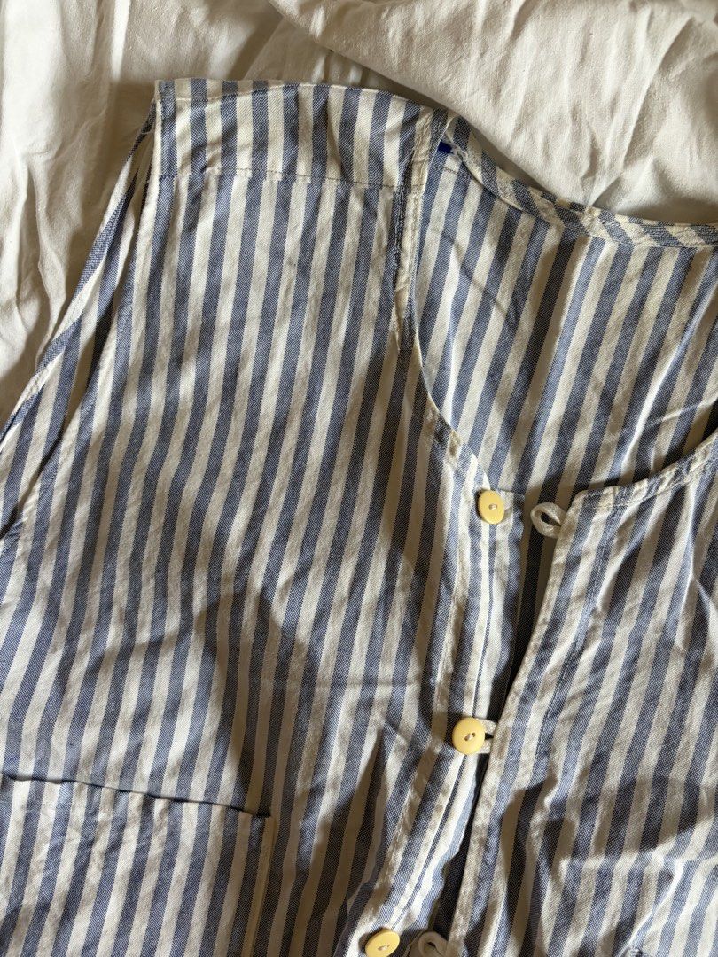 Striped Vest with Buttons (Category: Sleeveless) located in Manila. Submitted by andreacap (Listing ID 1437966793, Image 3). Description: - Blue and white striped pattern - Button-up front - Round neckline - Two front pockets - Lightweight fabric - Sleeveless design - Minor tear on the side - Minor stains 🎀 currently decluttering/selling pre-loved clothes, check my page for more details! 🎀 please manage expectations, you may send me a dm for mo
