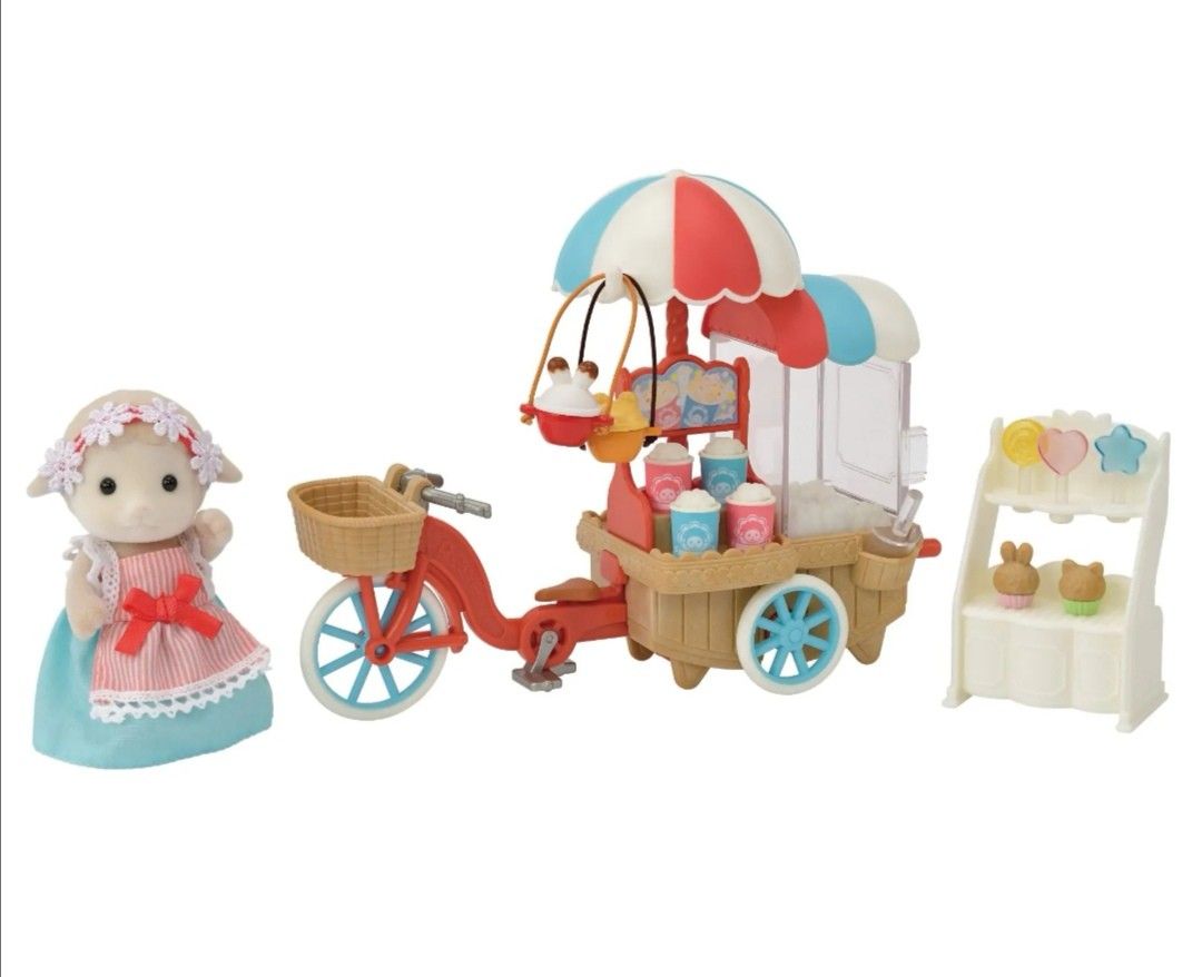 Sylvanian Families Popcorn Cycle Set (Category: Toys & Games) located in Mandaluyong City. Submitted by ilovemyshop (Listing ID 1437991034, Image 2). Description: 💟 Brand New, never been out of the box Sylvanian Families set features a popcorn cycle with a red bicycle, a popcorn cart, and a sheep mother figure. It includes accessories like popcorn, baskets, and other small items. The set is designed for children aged 3 and above. The box has Jap