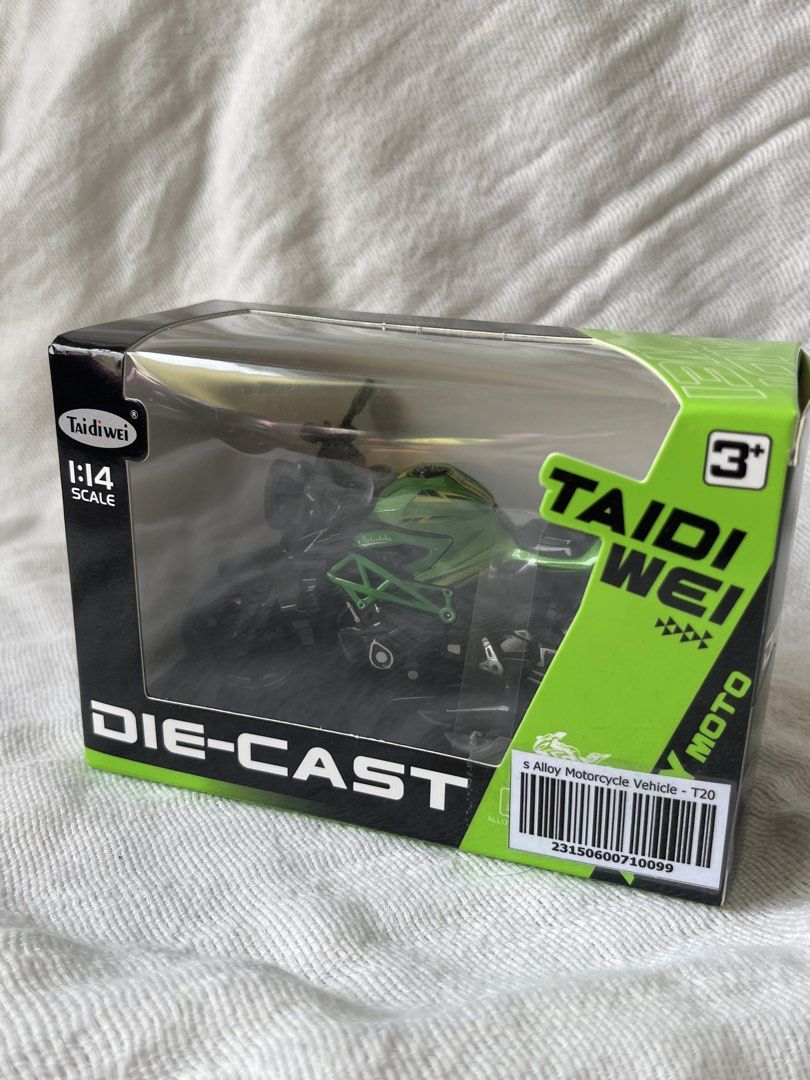 Taidi Wei Die-Cast Motorcycle 1:14 Scale (Category: Vehicle & Diecast Models) located in Manila. Submitted by prima_onda (Listing ID 1437986392, Image 3). Description: - Taidi Wei die-cast motorcycle toy - Scale: 1:14 - Color: Green and Black - Model: 5 Alloy Motorcycle Vehicle - T20 - Recommended Age: 3+ - Includes original box.