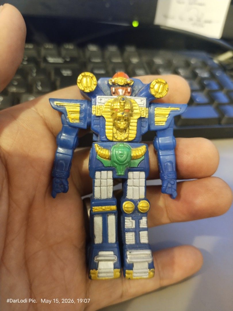 Vintage Bandai 1995 Robot (Category: Figurines & Statues) located in Pasay City. Submitted by mancave07 (Listing ID 1438042432, Image 1). Description: - Vintage robot action figure - Blue and gold color scheme - Intricate details - Unique pharaoh-like head design - Detailed back - Made of plastic - Great for toy collectors!.