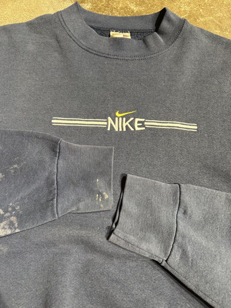 Vintage Nike Bootleg Crewneck Jacket (Category: Coats, Jackets and Outerwear) located in Cavite. Submitted by dracokidstuff (Listing ID 1438037025, Image 3). Description: Vintage Nike Bootleg Crewneck Jacket Size: XL Dimes: W25 L27 SL23 Very good condition Issue bleach stain - Vintage Nike sweatshirt - Navy blue color - Nike logo on chest - Made by Fruit of the Loom - Size: XL - Minor wear on sleeves.
