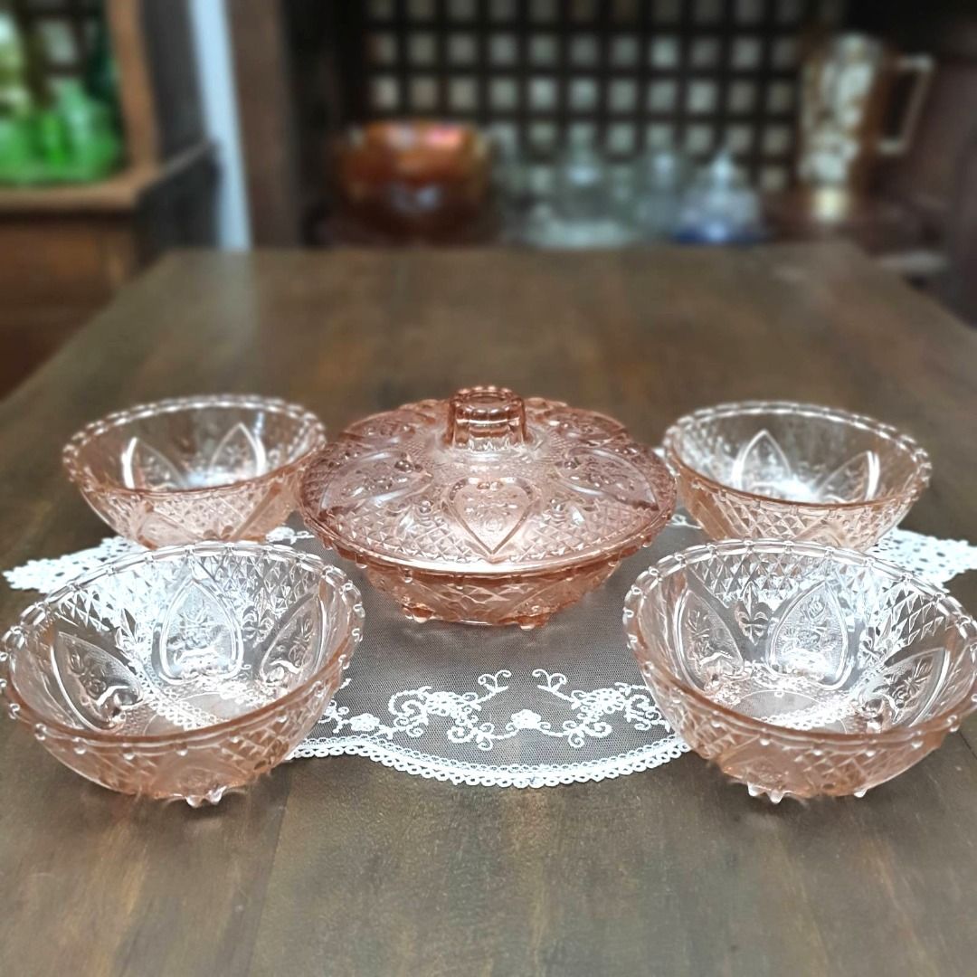 Vintage Pink Glass Serving Set (Category: Dinnerware & Cutlery) located in Pasig City. Submitted by fine.finds (Listing ID 1438046528, Image 1). Description: This vintage pink glass dessert bowl set and candy jar instantly adds romantic vintage elegance to desserts, candies, and decorative table styling. The soft blush tone gives a dainty, warm and playful feel to these entertaining pieces. Perfect for collectors, cottagecore interiors, or elevat