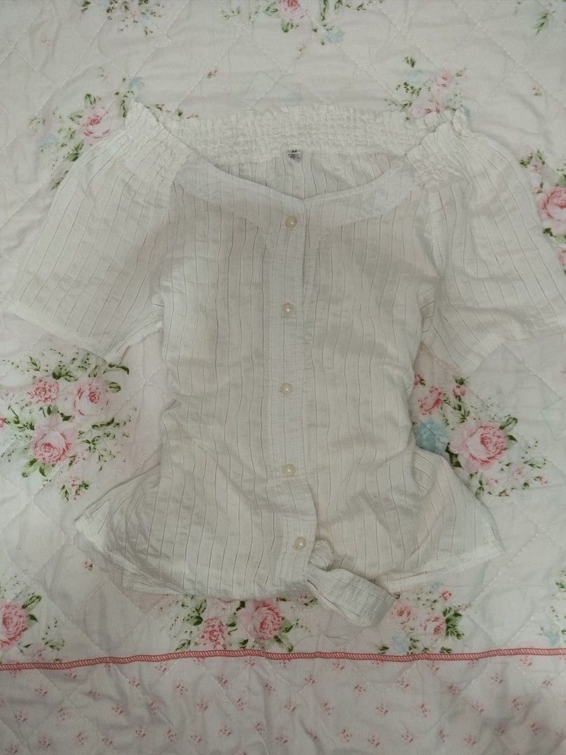 White Striped Blouse babydoll (Category: Blouses) located in Manila. Submitted by niacloset.nia (Listing ID 1437990518, Image 1). Description: small to med - White blouse with vertical stripes - Button-down front - Short sleeves - Gathered neckline detail - Slightly off-shoulder design - Lightweight fabric, ideal for warm weather.