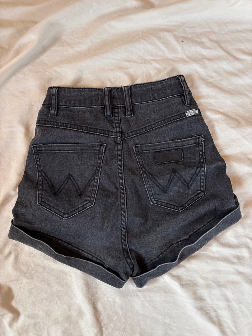 Wrangler High-Waisted Denim Shorts (Category: Shorts) located in Subic. Submitted by joyclutter (Listing ID 1437954319, Image 2). Description: S-M 26-27 - Wrangler denim shorts - High-waisted design - Dark grey wash - Classic five-pocket style - Button closure - Rolled-up cuffs - Wrangler logo on back pocket - Ideal for everyday casual wear.