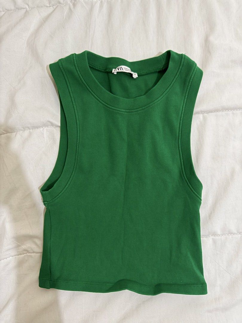 Zara Green Tank Top (Category: Sleeveless) located in Manila. Submitted by hi_sssea (Listing ID 1438090285, Image 1). Description: - Zara green cropped tank top - Round neckline - Sleeveless - Ribbed knit fabric - Solid green color - Tag is visible.