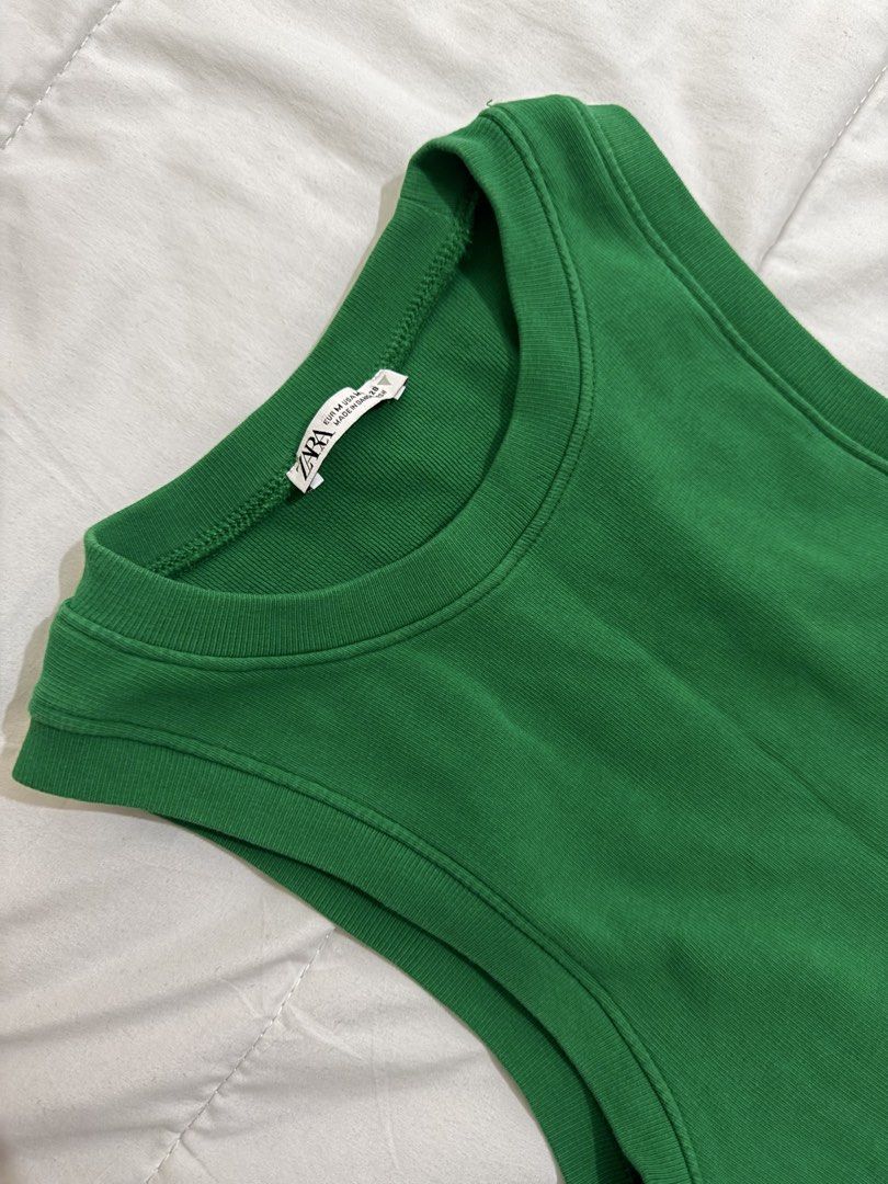 Zara Green Tank Top (Category: Sleeveless) located in Manila. Submitted by hi_sssea (Listing ID 1438090285, Image 2). Description: - Zara green cropped tank top - Round neckline - Sleeveless - Ribbed knit fabric - Solid green color - Tag is visible.