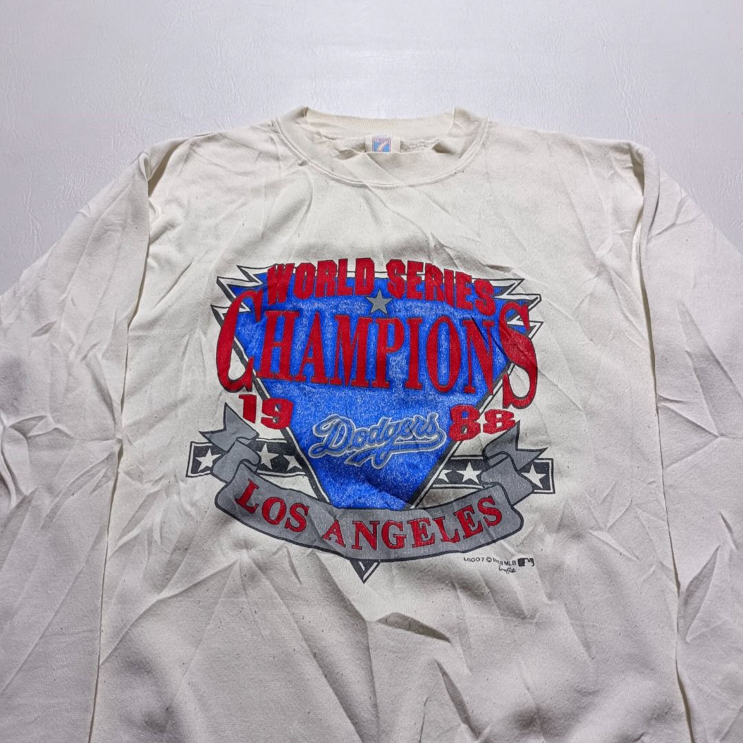 Vintage Dodgers Sweater Dated 1988 (Category: Activewear) located in Baguio. Submitted by freshmarket_2600 (Listing ID 1438124428, Image 2). Description: Brand: Vintage Logo 7 Dodgers World Series Dated 1988 Tags: Complete Size: S mens Dimension: L25.5W20.5 Condition: Excellent Color rate: 10/10 Color: White Issue/s: None.