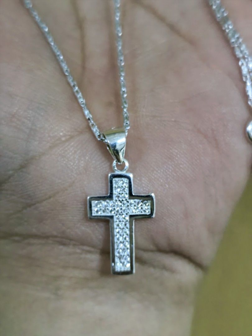 925 Silver Cross Necklace (Category: Necklaces) located in Taguig. Submitted by jeannescarlet (Listing ID 1438200153, Image 2). Description: 💎Brand New 💎925 Silver 💎Chain length 17 inches Please note: Cross Pendant has slight flaws... But barely noticeable. Please check second photo.