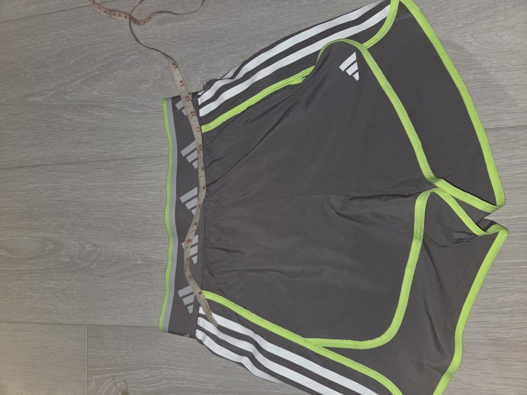 B1T1 Adidas Running Shorts - Gray (Category: Activewear) located in Pasig City. Submitted by igotchugirl (Listing ID 1438163018, Image 2). Description: NO WORN PIC PLEASE GOOGLE IT- Adidas running shorts - Gray with white stripes and neon green trim - Elastic waistband with Adidas logo - Size: M BUT FITS XS AND S GIRLS - Made in Thailand - Perfect for running and other sports.
