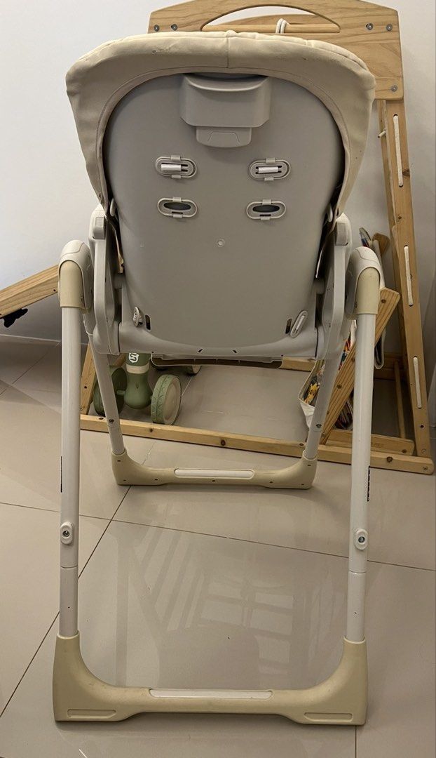 Akeeva Cozzi Baby High Chair (Category: Baby High Chairs) located in Cainta. Submitted by ttrreeeesshh (Listing ID 1438286266, Image 3). Description: - Brand: Akeeva - Model: Cozzi Luxury - Color: Beige - Original Price: 7,200 - RFS: Decluttering - Five-point harness for safety - Adjustable legs - Full recline - Foldable for easy storage - Padded seat for comfort - Includes armrests and footrest - Includes tray for direct feeding.