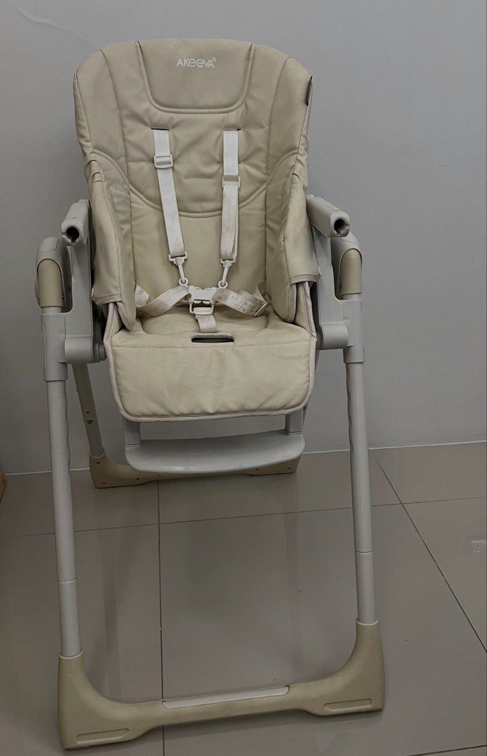 Akeeva Cozzi Baby High Chair (Category: Baby High Chairs) located in Cainta. Submitted by ttrreeeesshh (Listing ID 1438286266, Image 1). Description: - Brand: Akeeva - Model: Cozzi Luxury - Color: Beige - Original Price: 7,200 - RFS: Decluttering - Five-point harness for safety - Adjustable legs - Full recline - Foldable for easy storage - Padded seat for comfort - Includes armrests and footrest - Includes tray for direct feeding.