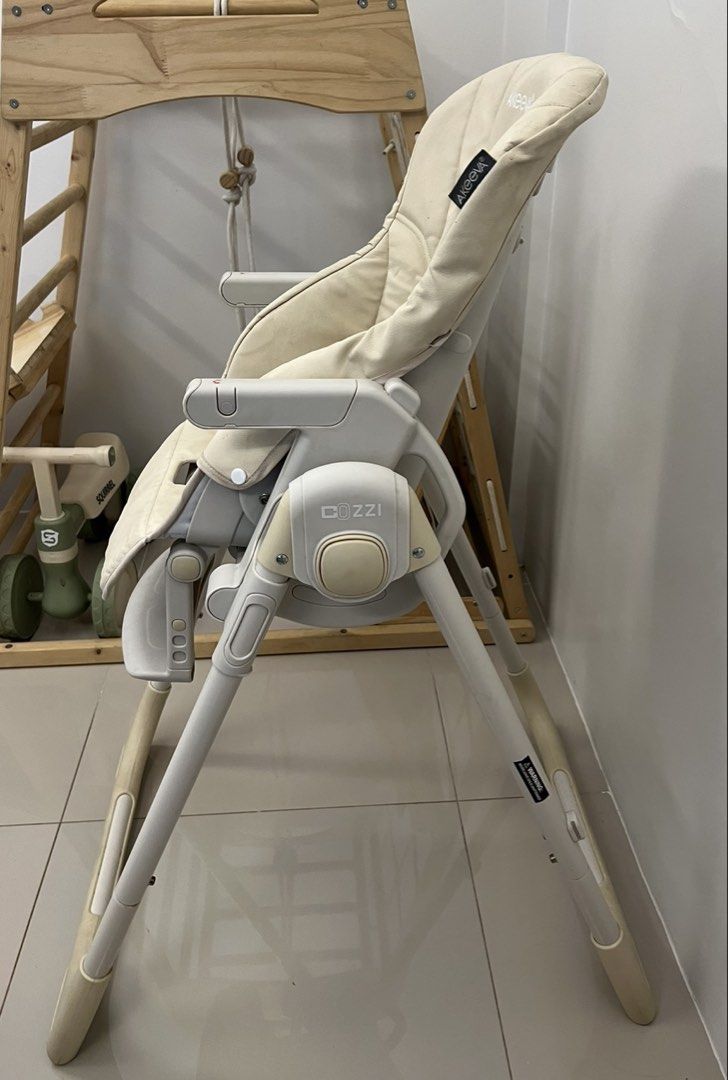 Akeeva Cozzi Baby High Chair (Category: Baby High Chairs) located in Cainta. Submitted by ttrreeeesshh (Listing ID 1438286266, Image 2). Description: - Brand: Akeeva - Model: Cozzi Luxury - Color: Beige - Original Price: 7,200 - RFS: Decluttering - Five-point harness for safety - Adjustable legs - Full recline - Foldable for easy storage - Padded seat for comfort - Includes armrests and footrest - Includes tray for direct feeding.