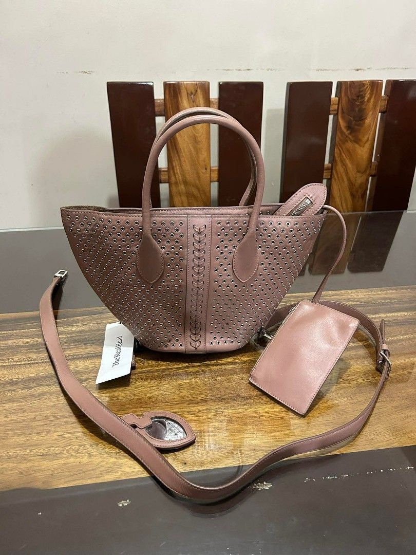 Alaïa Eyelit Leather - Handbag (Pre-Loved) (Category: Luxury Bags & Wallets) located in General Trias. Submitted by jj_collective_arch (Listing ID 1438228557, Image 1). Description: Alaïa Eyelit Leather Handbag 🛍️ Selling Price: ₱ 17,899.00 ✅ Pre-Loved ✅ See Photos for the Issues ‼️ like teared Strap etc..
