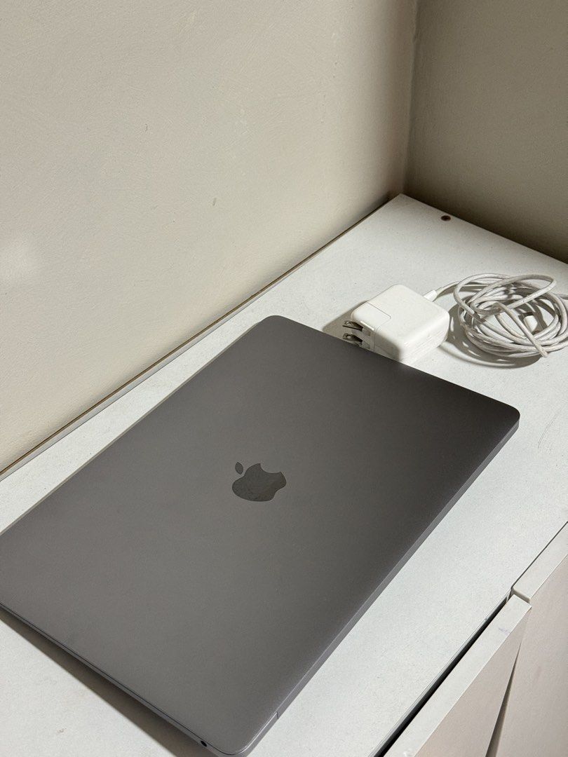 Apple MacBook Air 13-inch 2020 (Category: Laptops & Notebooks) located in Manila. Submitted by dailyessential.ph (Listing ID 1438151166, Image 2). Description: - MacBook Air 13-inch (2020 model) - 1.1GHz Quad-Core Intel Core i5 processor - 8GB RAM - 256GB storage - Includes original charger - Battery health: Normal - Screen displays macOS desktop - Color: Gray.