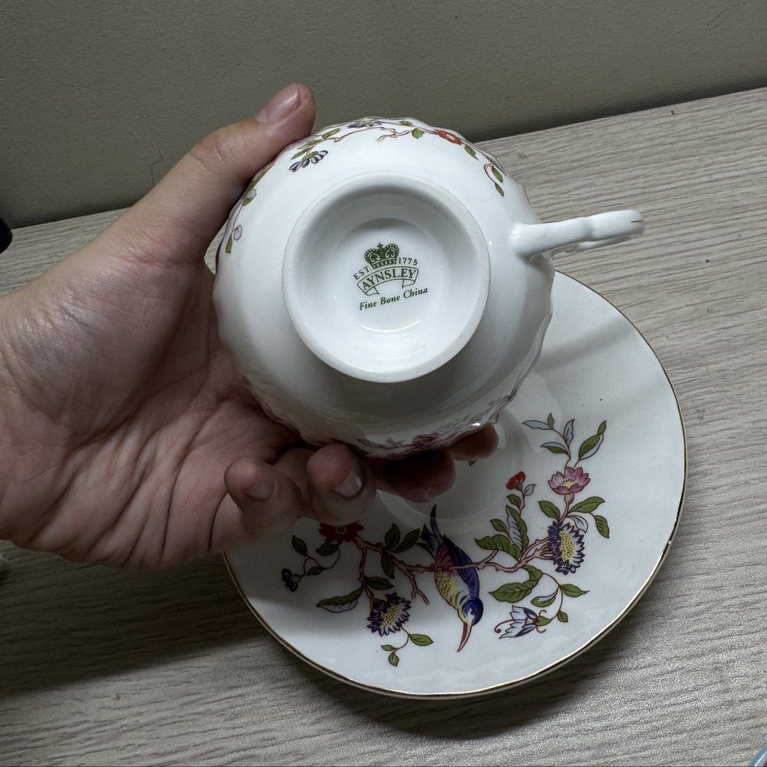 Aynsley Cup and Saucer (Category: Coffee & Tea Tableware) located in Manila. Submitted by tibialisanticus (Listing ID 1438211241, Image 2). Description: - Aynsley tea cup and saucer set - Features a floral and bird design - Elegant gold trim rfs: decluttering.