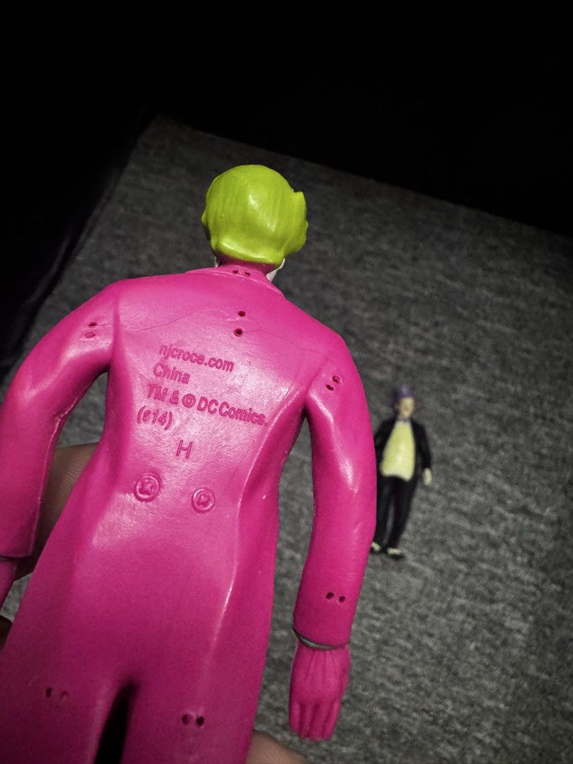 Batman The Joker and Penguin Action Figures Vintage (Category: Toys & Games) located in President Roxas. Submitted by isserminator (Listing ID 1438303006, Image 2). Description: - Vintage Batman action figures featuring The Joker and The Penguin. - The Joker: Pink suit, green hair. - The Penguin: Black suit, purple hat. - Figures marked with "njcroce.com" and "TM & DC Comics." - Made in China..