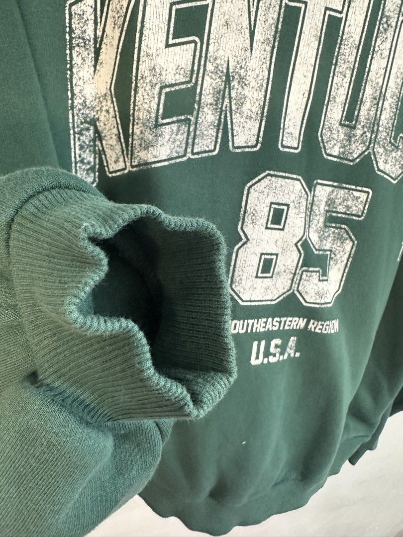 Bershka Kentucky Sweatshirt (Category: Coats, Jackets and Outerwear) located in Manila. Submitted by markokostlich (Listing ID 1438218949, Image 3). Description: - Bershka sweatshirt - Green color - "Kentucky 85" print - Crew neck - Long sleeves - Size M (EUR, USA, MEX) 📌𝙍𝙀𝙈𝙄𝙉𝘿𝙀𝙍𝙎 ♡ Mine now, pay now ♡ Please manage your expectation coz these are preloved items. ♡ Color may slightly vary due to lighting. ♡ SF depends on your location 📦