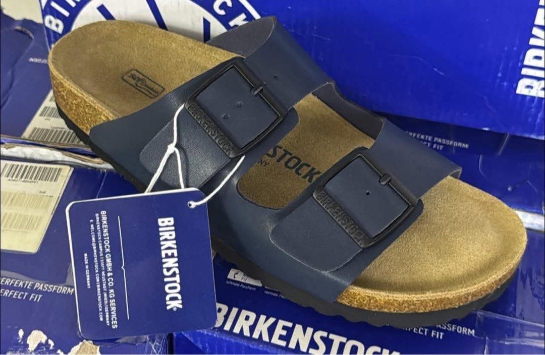 Birkenstocks Arizona Sandals (Category: Slippers & Slides) located in Makati City. Submitted by nooktown (Listing ID 1438242275, Image 1). Description: Birkenstocks Arizona Sandals • navy blue - size 38 only available • brand new • 1 pair left flaw: damaged shoebox.