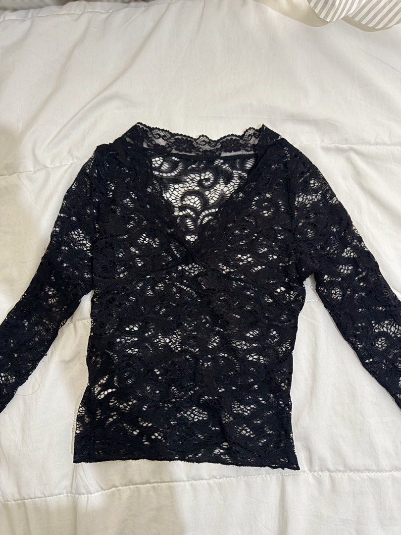 Black Lace Top (Category: Sleeveless) located in Manila. Submitted by hi_sssea (Listing ID 1438220714, Image 1). Description: - Elegant black lace top - V-neck design - Long sleeves - Delicate lace pattern - Perfect for layering - Dress up or down - Suitable for various occasions.