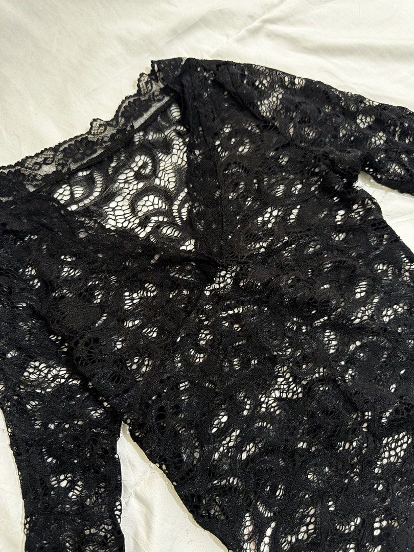 Black Lace Top (Category: Sleeveless) located in Manila. Submitted by hi_sssea (Listing ID 1438220714, Image 2). Description: - Elegant black lace top - V-neck design - Long sleeves - Delicate lace pattern - Perfect for layering - Dress up or down - Suitable for various occasions.