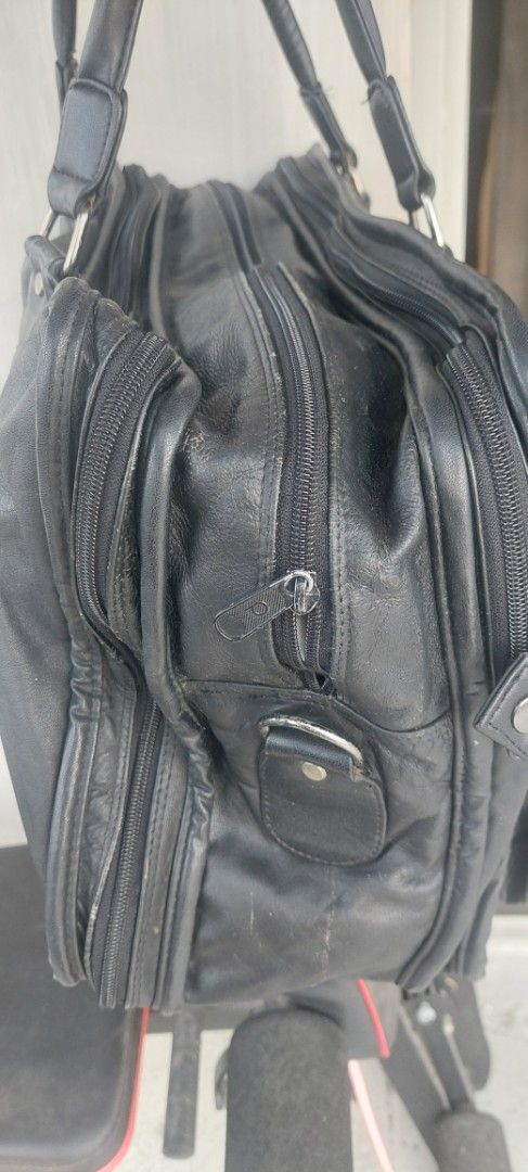 Black Leather Bag with Multiple Compartments (Category: Tote Bags) located in Batangas. Submitted by roams (Listing ID 1438162987, Image 3). Description: - Black leather bag - Multiple compartments - Handle and shoulder strap - Two front pockets with buckles - Top zipper closure - Rectangular shape may konte lang flaw na tatahiin pm sa interested.