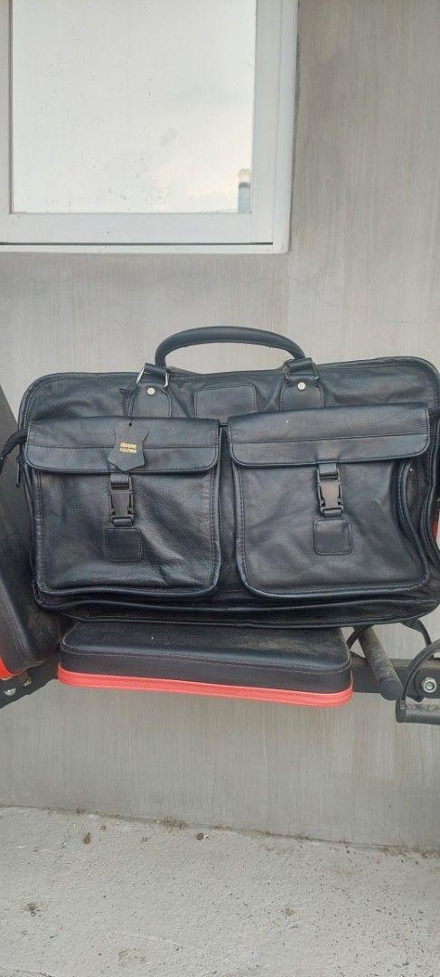Black Leather Bag with Multiple Compartments (Category: Tote Bags) located in Batangas. Submitted by roams (Listing ID 1438162987, Image 1). Description: - Black leather bag - Multiple compartments - Handle and shoulder strap - Two front pockets with buckles - Top zipper closure - Rectangular shape may konte lang flaw na tatahiin pm sa interested.