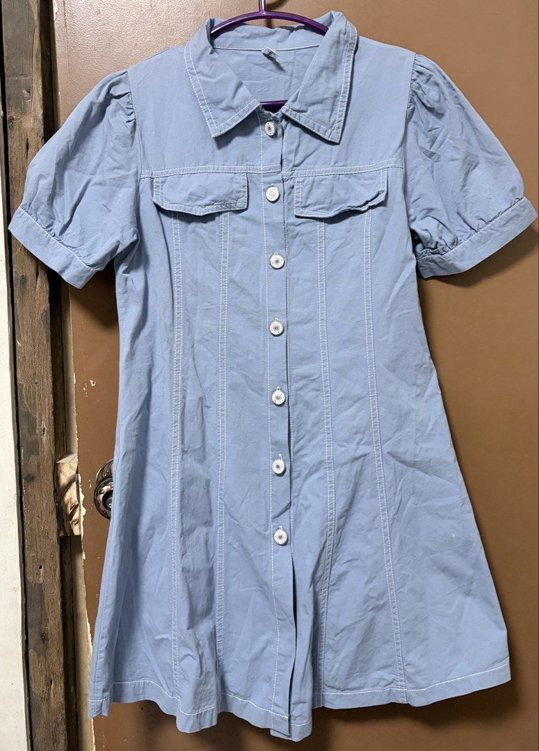 Blue/Denim-like Button-Down Puff Sleeved Dress (Category: Dresses) located in Meycauayan. Submitted by _cbear (Listing ID 1438271659, Image 1). Description: - Light blue/Light Denim Colored dress - White stitching details - Collared neckline - Short puff sleeves - Button-down front - Two chest pockets - Slightly flared skirt - Lightweight HQ Fabric - XS to M - an inch or so above the knee of a 5’3.