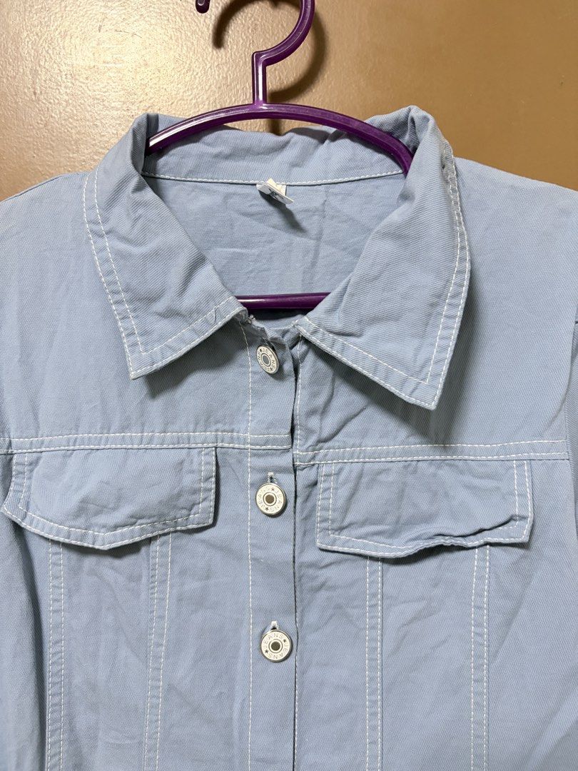 Blue/Denim-like Button-Down Puff Sleeved Dress (Category: Dresses) located in Meycauayan. Submitted by _cbear (Listing ID 1438271659, Image 2). Description: - Light blue/Light Denim Colored dress - White stitching details - Collared neckline - Short puff sleeves - Button-down front - Two chest pockets - Slightly flared skirt - Lightweight HQ Fabric - XS to M - an inch or so above the knee of a 5’3.