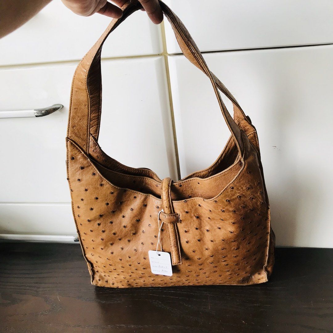 Brown Ostrich Leather Shoulder Bag (Category: Shoulder Bags) located in Baao. Submitted by all.things.japan (Listing ID 1438194209, Image 2). Description: - Brown ostrich leather shoulder bag - Single shoulder strap - Flap closure with buckle - Spacious interior - Metal feet - Distinctive textured pattern 12.5 x 3.0 x 12.0 inches.