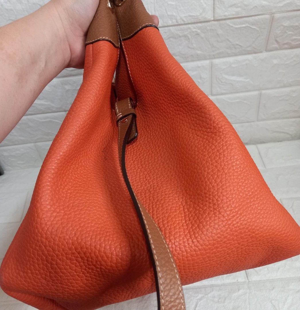 Bruno Magli Hobo 2-way Handbag (Category: Shoulder Bags) located in Las Pinas. Submitted by etoksi1234 (Listing ID 1438261478, Image 3). Description: Pre-loved Bruno Magli hobo 2-way handbag in a vibrant orange hue. Pebbled leather with gold-tone hardwares..