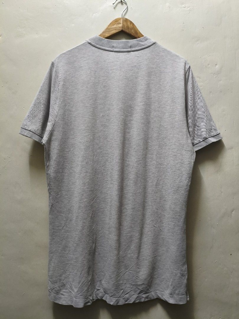 Calvin Klein Gray Henley Shirt (Category: Tshirts & Polo Shirts ) located in Mandaluyong City. Submitted by frivsthriftsph (Listing ID 1438198322, Image 2). Description: Calvin Klein Gray Henley Shirt Lightly used condition. Color rate is 10/10. Size XL on tag. Actual dimes are 22W by 31L. No other issues aside from repaired hole sa likod. See 5th pic for reference..