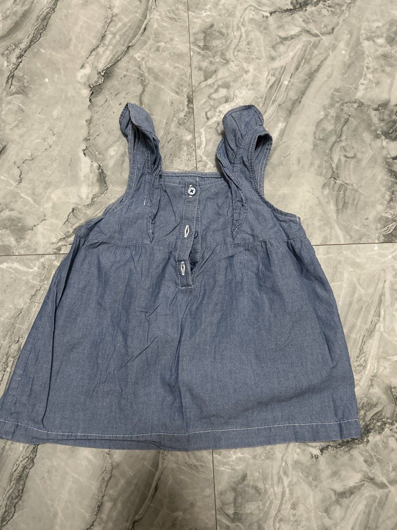 Carter's Denim Dress - 4T (Category: Babies & Kids Fashion) located in Gapan. Submitted by mysticrabbit-3195 (Listing ID 1438224200, Image 3). Description: - Carter's denim dress - Size: 4T - Design: Tie straps and button details - Made in Cambodia - Great for everyday wear and special occasions.