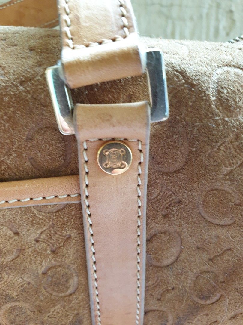 Celine C Macadam Brown Suede Handbag (Category: Luxury Bags & Wallets) located in Las Pinas. Submitted by anggesmart (Listing ID 1438299684, Image 2). Description: - Preloved Celine C Macadam Boston Bag - Brown suede material - Cylindrical shape - Leather handles and straps - Embossed 'C' pattern - Top zipper closure - Front pocket - Repeating pattern interior lining - With signs of usage, leather strap needs repair/ replacement Suede body needs 