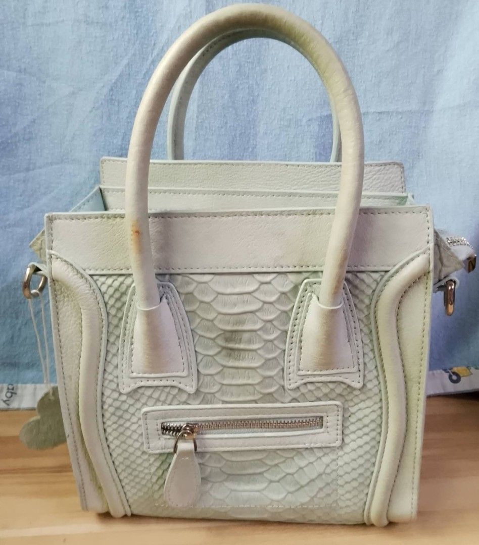 Celine Mini Luggage Handbag (Category: Luxury Bags & Wallets) located in San Juan City. Submitted by prestinebag (Listing ID 1438127665, Image 1). Description: - Celine Mini Luggage handbag - Unique snakeskin pattern - Light green color - Top handle design - Zipper closure - Small front pocket - Spacious interior - take all 4.