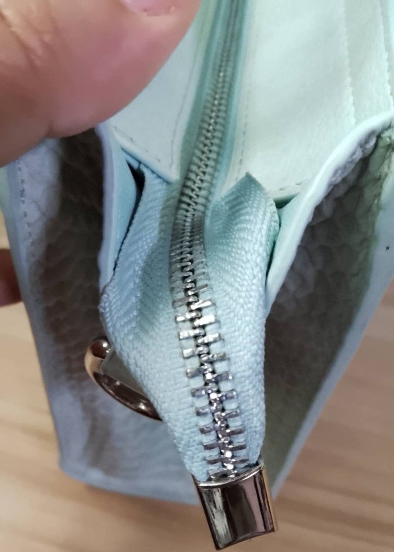 Celine Mini Luggage Handbag (Category: Luxury Bags & Wallets) located in San Juan City. Submitted by prestinebag (Listing ID 1438127665, Image 3). Description: - Celine Mini Luggage handbag - Unique snakeskin pattern - Light green color - Top handle design - Zipper closure - Small front pocket - Spacious interior - take all 4.