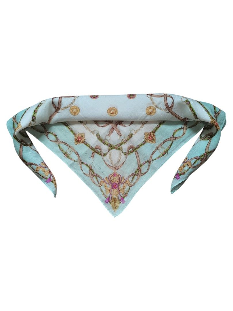 Celine Silk Scarf (Category: Scarves) located in Manila. Submitted by eagerbeaverph (Listing ID 1438198745, Image 2). Description: Celine silk scarf handkerchief - Features a beautiful chain and floral design - Light blue border with gold and pink accents - Celine logo visible - Adds a touch of luxury to any outfit - Versatile styling options Celine light green handkerchief featuring a chain and emblem handkerchief 45 * 45 cm stains Signs of usag