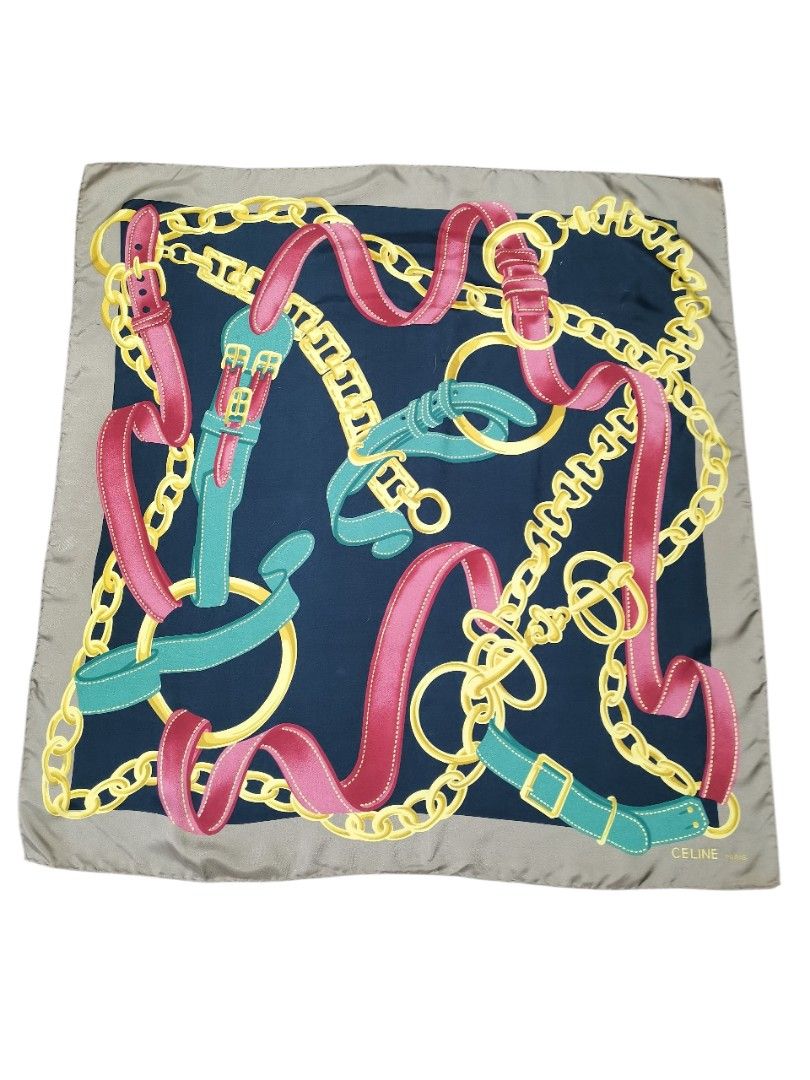 Celine Silk Scarf (Category: Scarves) located in Manila. Submitted by eagerbeaverph (Listing ID 1438217031, Image 1). Description: - Authentic Celine silk scarf - Navy blue background - Features a design of chains, belts, and ribbons in pink, green, and gold - Light brown border - Made in Italy - 100% silk Celine vintage silk scarf featuring a chain and buckle motif 33 x L32 inches Normal signs of usage No inclusions Dm .