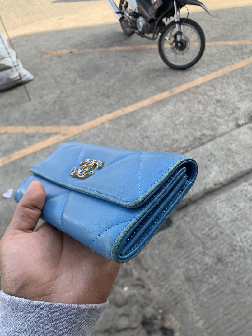 Chanel 19 Long Flap Wallet (Category: Luxury Bags & Wallets) located in Polomolok. Submitted by domingthriftclothes (Listing ID 1438114220, Image 3). Description: - Authentic Chanel 19 long flap wallet - Beautiful blue color - Iconic CC turn-lock closure - Diamond-quilted design - Multiple card slots and compartments - Features snap closure with Chanel logo.