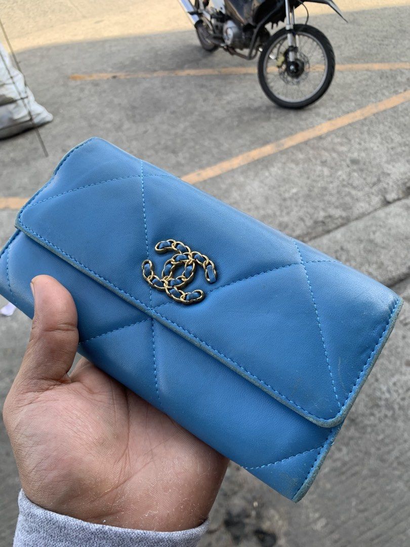 Chanel 19 Long Flap Wallet (Category: Luxury Bags & Wallets) located in Polomolok. Submitted by domingthriftclothes (Listing ID 1438114220, Image 2). Description: - Authentic Chanel 19 long flap wallet - Beautiful blue color - Iconic CC turn-lock closure - Diamond-quilted design - Multiple card slots and compartments - Features snap closure with Chanel logo.