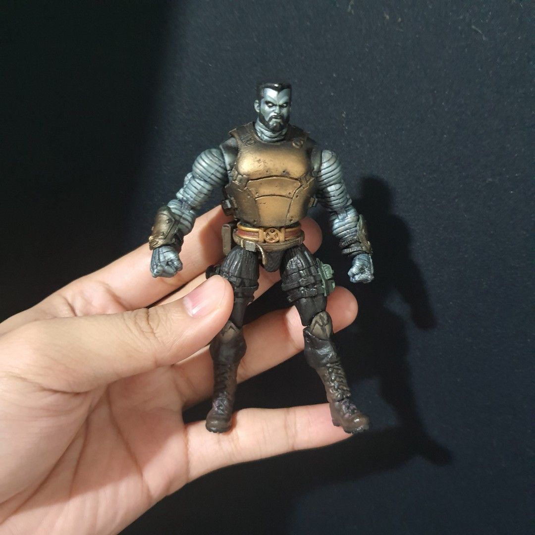 Colossus Action Figure (Category: Figurines & Statues) located in Las Pinas. Submitted by gabbuencam69723 (Listing ID 1438128581, Image 1). Description: - Highly detailed action figure - Metallic gold and grey color scheme - Articulated joints for dynamic posing - Features detailed armor and helmet - Ideal for collectors and fans of science fiction and fantasy.