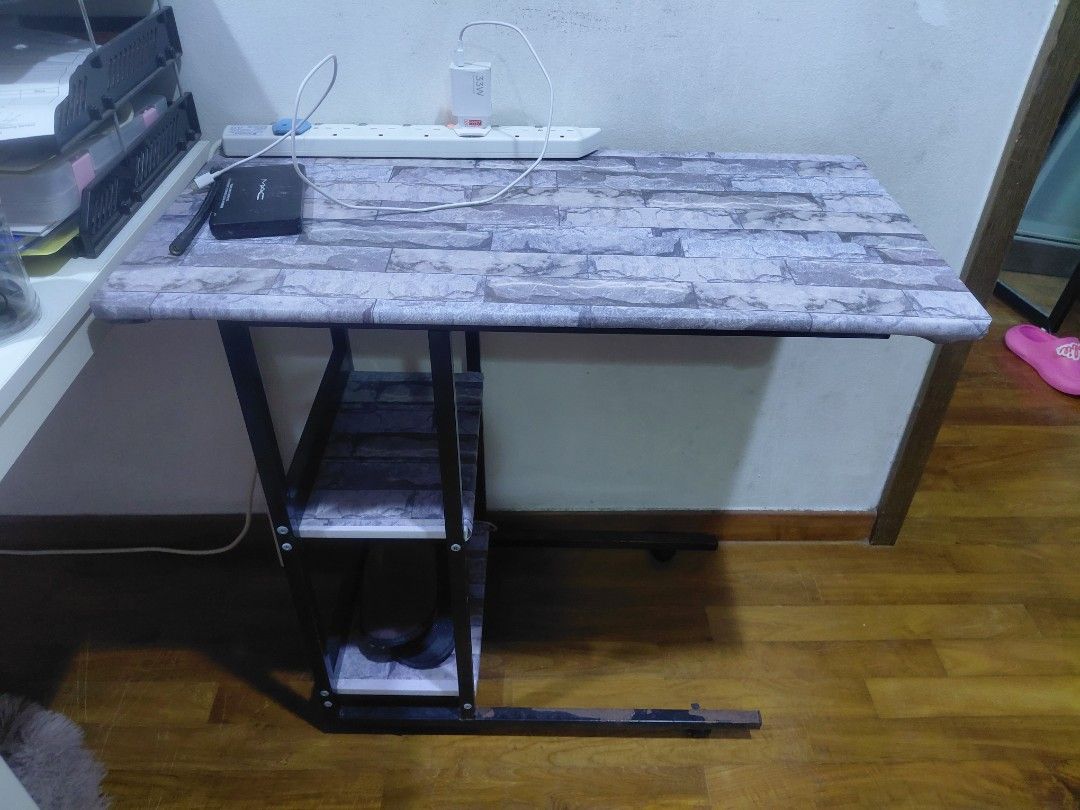 Computer table (Category: Tables & Sets) located in Singapore. Submitted by avf_solution (Listing ID 1438221501, Image 1). Description: Computer Table - Stylish brick-patterned top - Includes a convenient storage shelf - Sturdy and easy to move - Ideal for laptop or bedside use.