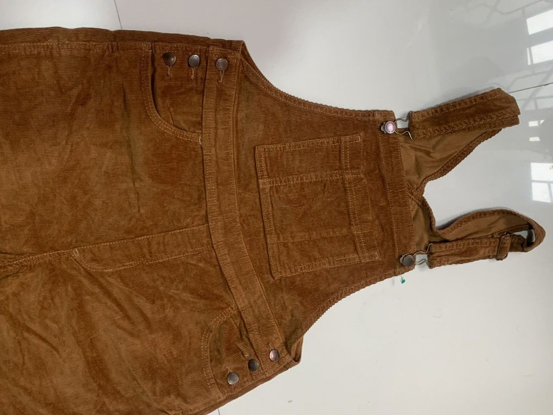 Corduroy Overalls - Brown (Category: Jumpsuits) located in Cabuyao City. Submitted by burberrymaki (Listing ID 1438226427, Image 3). Description: - Brown corduroy overalls - Adjustable straps - Multiple pockets - Metal button closures - Straight leg design - Soft corduroy material - Classic, timeless style.